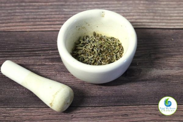 Dried lavender buds in a grinding mortar